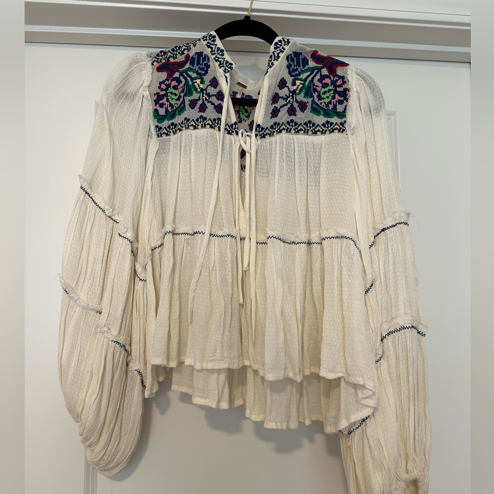 Free People white tie blouse with multi color detailing. Size XS.